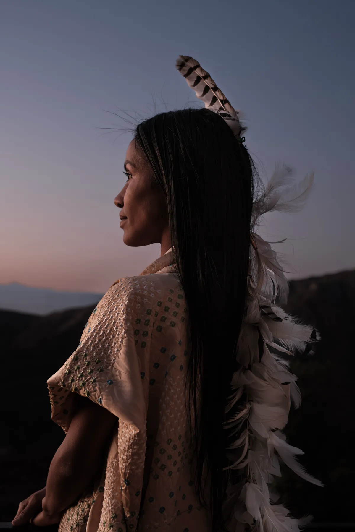Tatiana at dusk wearing feathers